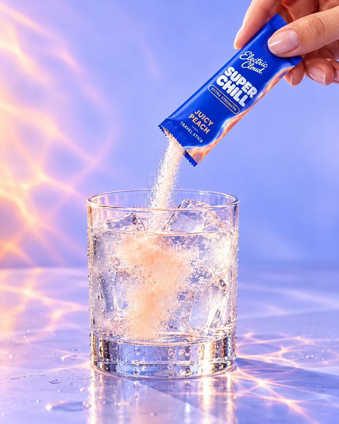 A hand pours a Juicy Peach Super Chill travel stick into a cold glass with ice